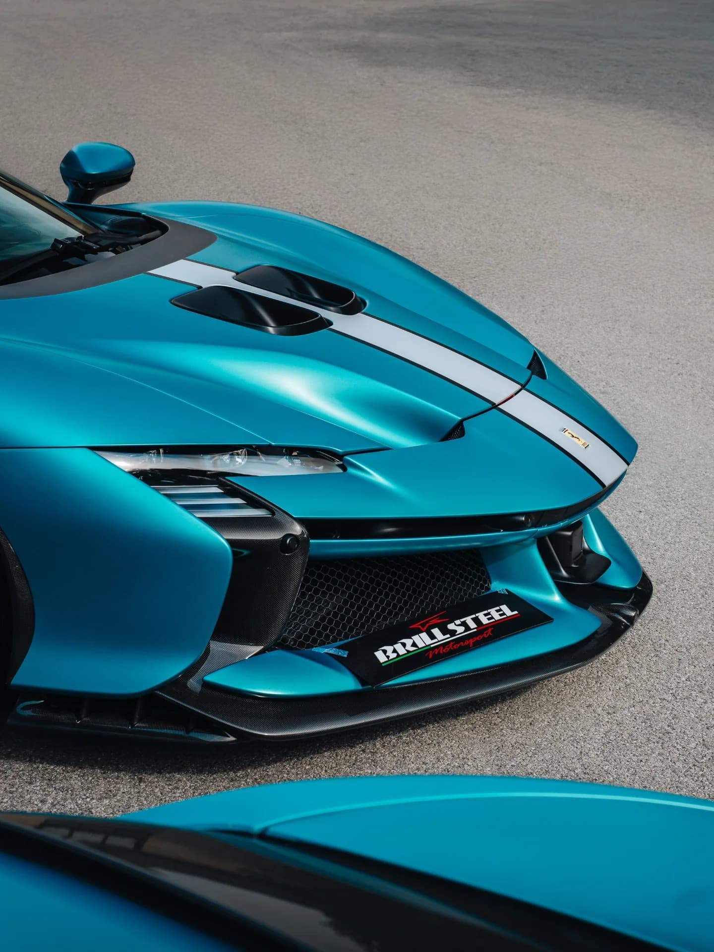 Matte teal Ferrari front with Brill-Steel carbon splitter detail
